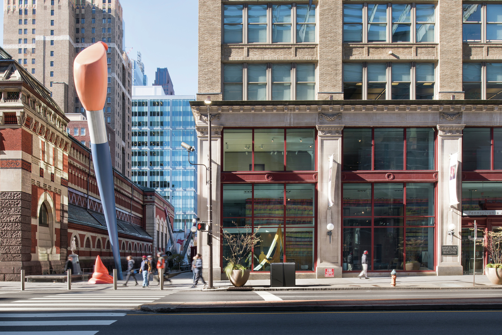 A photo of the exterior of the Pennsylvania Academy of the Fin Arts, featuring a large sculpture of a paintbrush.